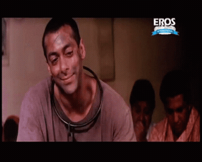 A Man With A Stethoscope Around His Neck Is On A Screen That Says Eros GIF