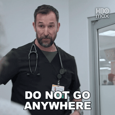 A Man With A Stethoscope Around His Neck Is Saying Do Not Go Anywhere GIF