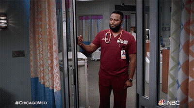 A Man With A Stethoscope Around His Neck Is Standing In A Hospital Room With The Hashtag #Chicagomed On The Bottom GIF