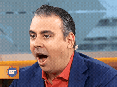 A Man With A Surprised Look On His Face And A Bt Logo Behind Him GIF