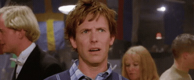 A Man With A Surprised Look On His Face Is In A Crowd Of People GIF