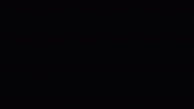 A Man With A Surprised Look On His Face Is Wearing A Black Jacket And A White Shirt With The Letter B On It GIF