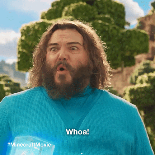 A Man With A Surprised Look On His Face Is Wearing A Blue Shirt That Says Whoa GIF