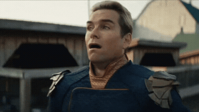 A Man With A Surprised Look On His Face Is Wearing A Blue Uniform GIF