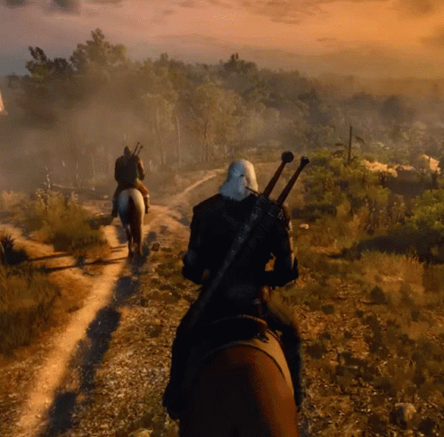 A Man With A Sword Is Riding A Horse Down A Dirt Path GIF