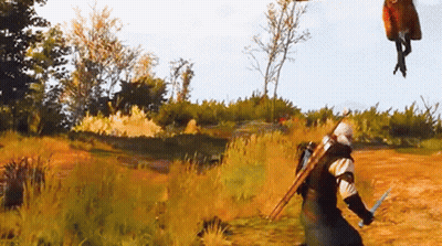 A Man With A Sword Is Standing In A Field With A Horse Flying In The Air GIF