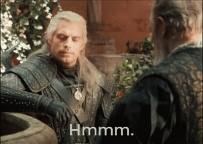 A Man With A Sword Is Standing Next To Another Man With The Word Hmm Written Below Him GIF