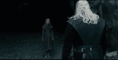 A Man With A Sword Stands In Front Of A Giant Monster GIF