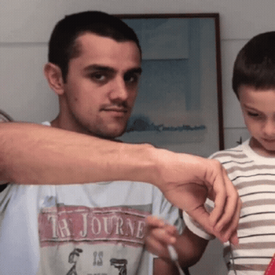 A Man With A Ta Journe Shirt On GIF