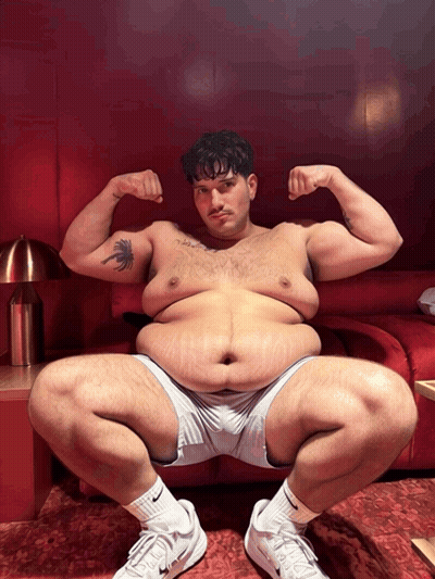 A Man With A Tattoo Of A Palm Tree On His Arm Squatting Down GIF