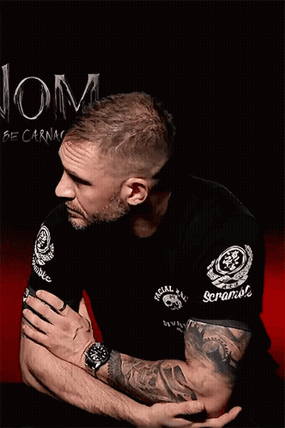 A Man With A Tattoo On His Arm Is Wearing A Black Shirt That Says Special Forces GIF