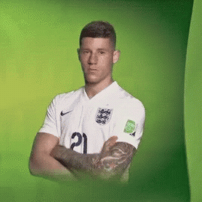 A Man With A Tattoo On His Arm Is Wearing A White Jersey With The Number 21 On It GIF