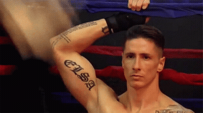 A Man With A Tattoo On His Arm That Says " Elisa " GIF