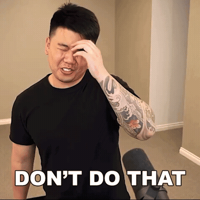 A Man With A Tattoo On His Arm Wipes His Forehead In Front Of A Sign That Says Do N't GIF