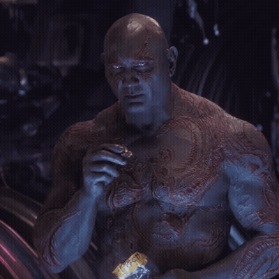 A Man With A Tattoo On His Chest Is Holding A Bottle That Says ' Ice Tea ' On It GIF