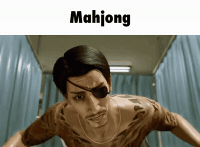 A Man With A Tattoo On His Chest Is Standing In Front Of A Sign That Reads Mahjong GIF