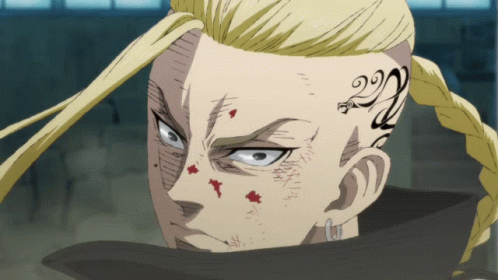 A Man With A Tattoo On His Face Has The Number 22 On His Forehead GIF