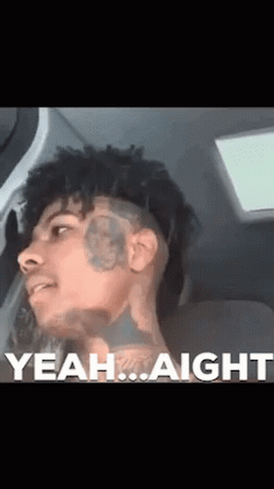A Man With A Tattoo On His Face Is Sitting In A Car With The Words Yeah Aight Behind Him GIF