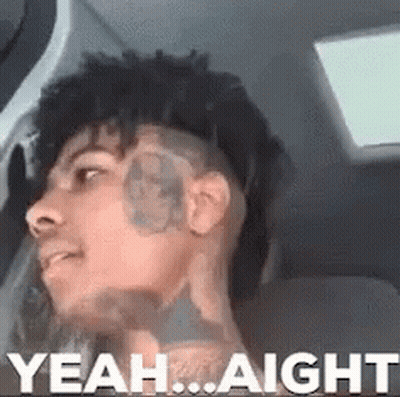 A Man With A Tattoo On His Face Is Sitting In A Car With The Words `` Yeah ... Aight '' Written Above Him . GIF