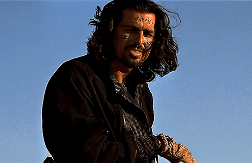 A Man With A Tattoo On His Face That Says ' I 'M A Fool ' GIF