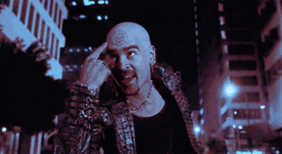 A Man With A Tattoo On His Forehead Is Giving The Middle Finger GIF