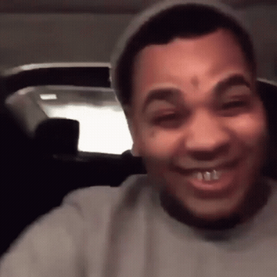 A Man With A Tattoo On His Forehead Is Smiling And Wearing A Hat GIF