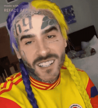 A Man With A Tattoo On His Forehead That Says ' 69 ' On It GIF