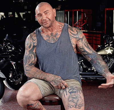 A Man With A Tattoo On His Leg That Says Hooligan On It GIF