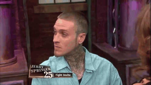 A Man With A Tattoo On His Neck Is On Jerry Springer 'S Fight Invite GIF