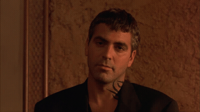 A Man With A Tattoo On His Neck Is Wearing A Suit GIF