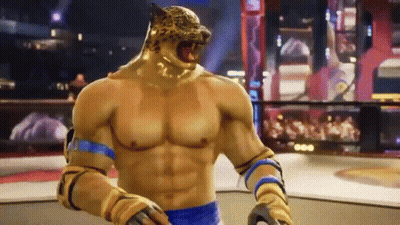 A Man With A Tiger Head Is Standing In A Boxing Ring In A Video Game . GIF
