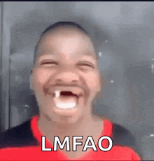 A Man With A Tooth In His Mouth Is Making A Funny Face With The Word Lmfao . GIF