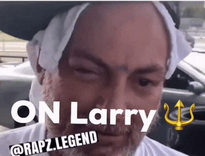 A Man With A Towel Around His Head And The Words " On Larry " Above Him GIF