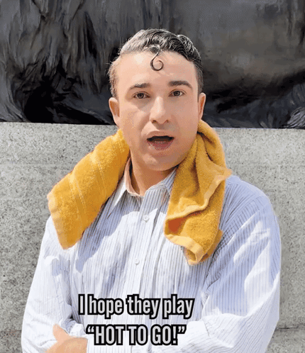 A Man With A Towel Around His Neck Says " I Hope They Play " Hot To Go " GIF