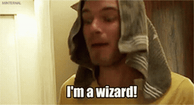 A Man With A Towel Wrapped Around His Head Is Saying I 'M A Wizard . GIF