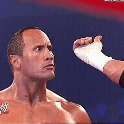 A Man With A W Logo On His Chest Is Being Punched In The Face GIF