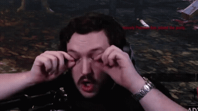 A Man With A Watch On His Wrist Is Making A Face With His Hands GIF