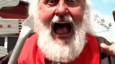A Man With A White Beard And A Red Shirt Has His Mouth Wide Open GIF