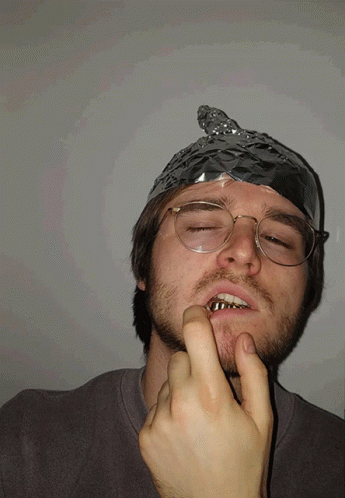 A Man With Aluminum Foil On His Head And Glasses GIF