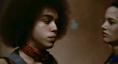 A Man With An Afro Says Hey Little Man You Want To Music . GIF