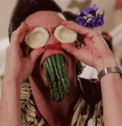 A Man With Asparagus Coming Out Of His Mouth And Onions On His Eyes GIF