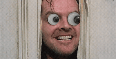 A Man With Big Eyes Looks Through A Hole In A Door With The Words Here 'S Johnny Written On It GIF
