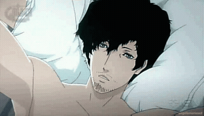 A Man With Black Hair And A Beard Is Laying In Bed . GIF