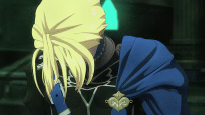 A Man With Blonde Hair And A Blue Cape Looks Down GIF