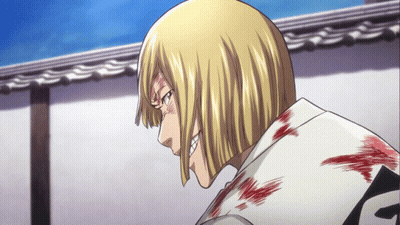 A Man With Blonde Hair And A White Shirt With The Letter F On The Back GIF