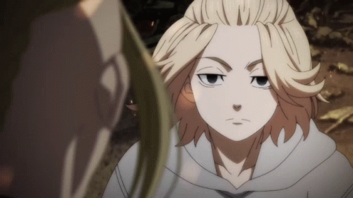 A Man With Blonde Hair Is Looking At Another Man In A White Hoodie GIF
