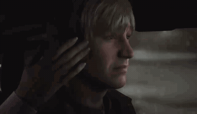 A Man With Blonde Hair Is Sitting In The Back Seat Of A Car . GIF