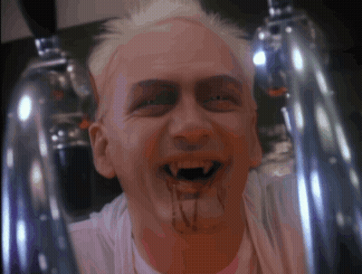 A Man With Blood Dripping From His Mouth And A White Shirt GIF