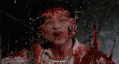 A Man With Blood On His Face Is Chained To Chains And Says Jesus Wept GIF