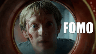 A Man With Blood On His Face Is Looking Through A Hole With The Word Fomo On It GIF
